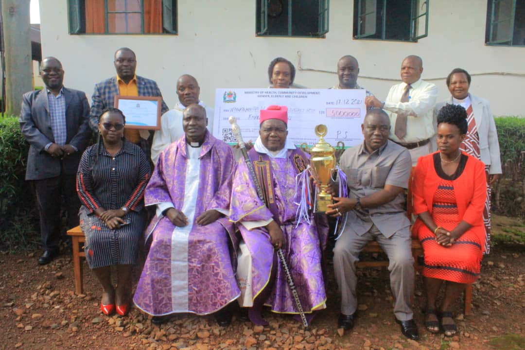 Bishop Dr.Bagonza and Hospital Leaders with Award 